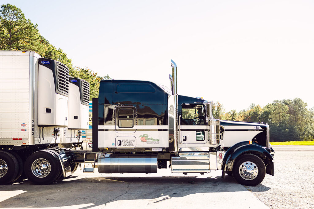 A large truck parked in the parking lot.