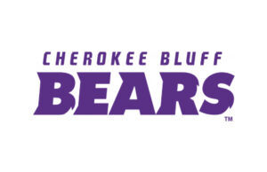 A purple and white logo for the cherokee bluff bears.