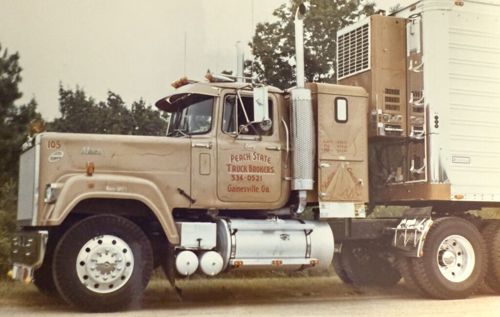 A large truck is parked on the side of the road.